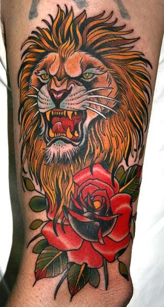 Red rose and lion tattoo