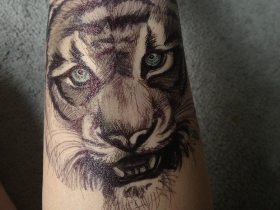 Scary human body tattoo lion