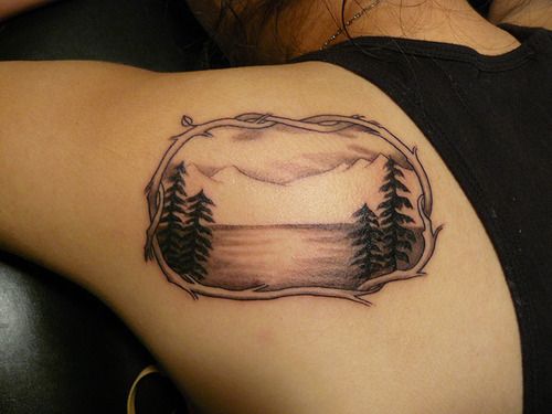 See and mountains tattoo