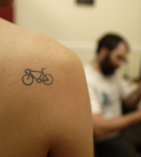 Shoulder bike tattoo