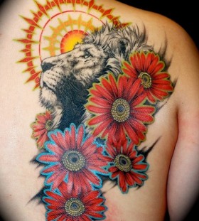 Sun and flowers lion tattoo