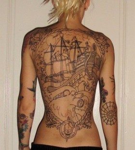Woman back ship tattoo