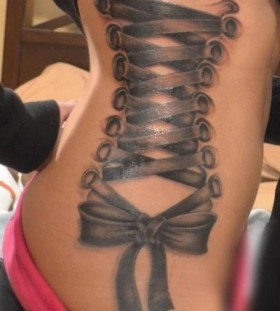Woman corset tattoo