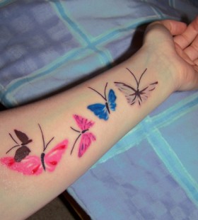 colored butterly on the arm