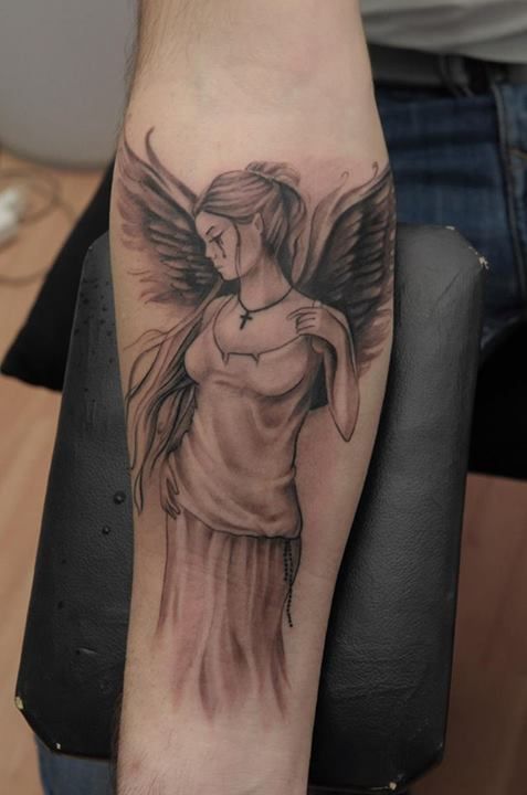 crying angel on arm