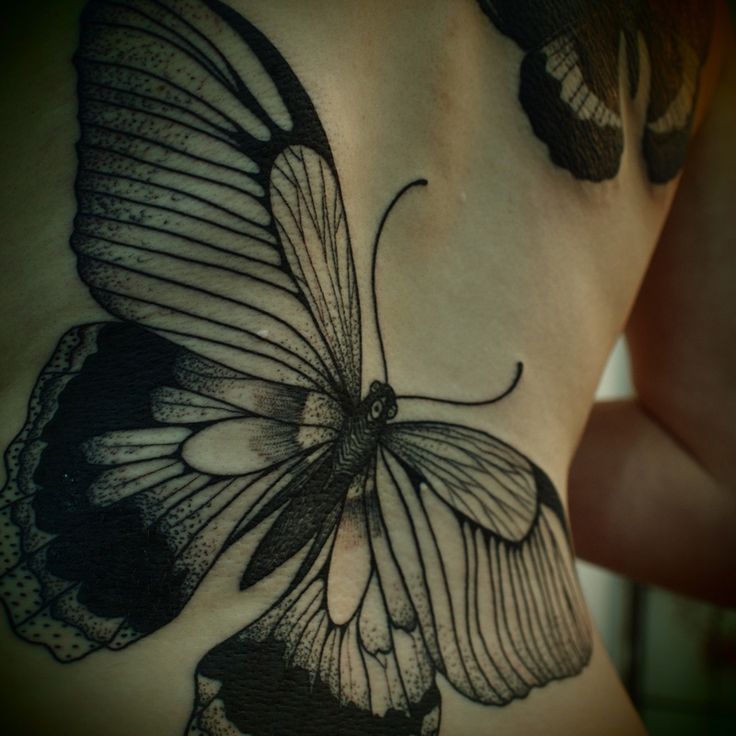 Adorable girl butterfly tattoo