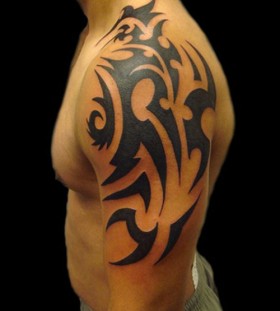 Amazing shoulder tribal tattoo