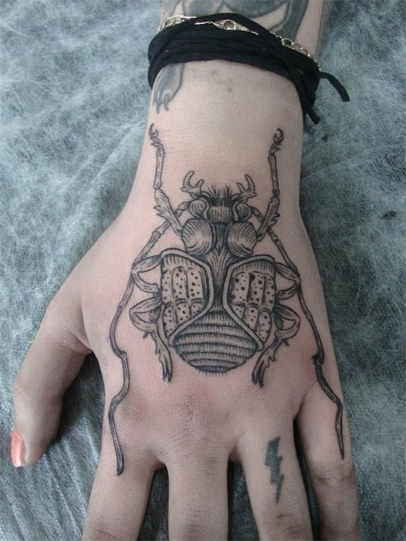 Awesome hand insect tattoo