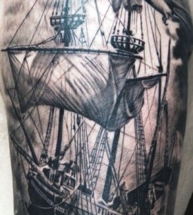 Black and grey ship tattoo