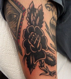 Black flowers tattoo by Dustin Barnhart
