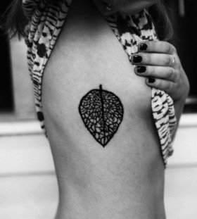 Black leaf tattoo