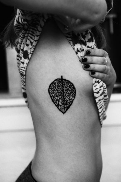 Black leaf tattoo