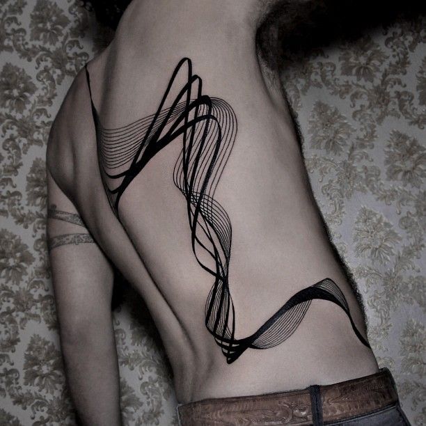 Black lines tattoo by Chaim Machlev