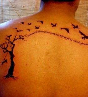 Black men's tree tattoo