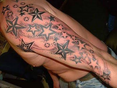 Black shoulder star tattoo