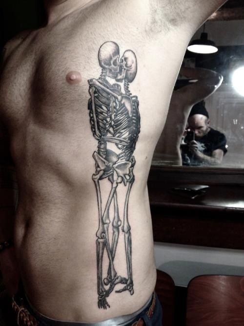 Black skull tattoo made by Berlin artist