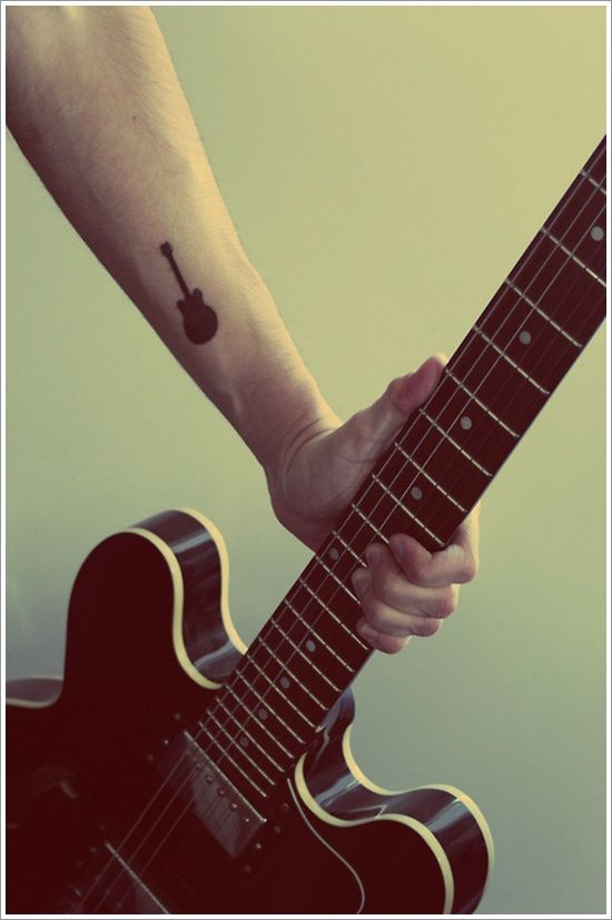 Black small guitar music style tattoo