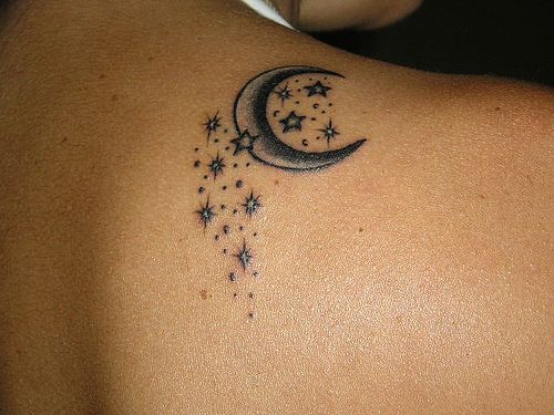 Black woman star and moon tattoo