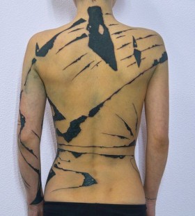 Black woman tattoo by Grisha Maslov