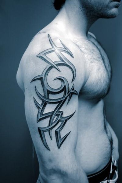 Blue shoulder tribal tattoo