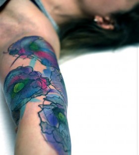 Blue sleeve tattoo made by Berlin artist