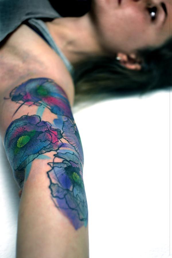 Blue sleeve tattoo made by Berlin artist