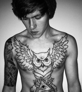 Boy chest owl tattoo
