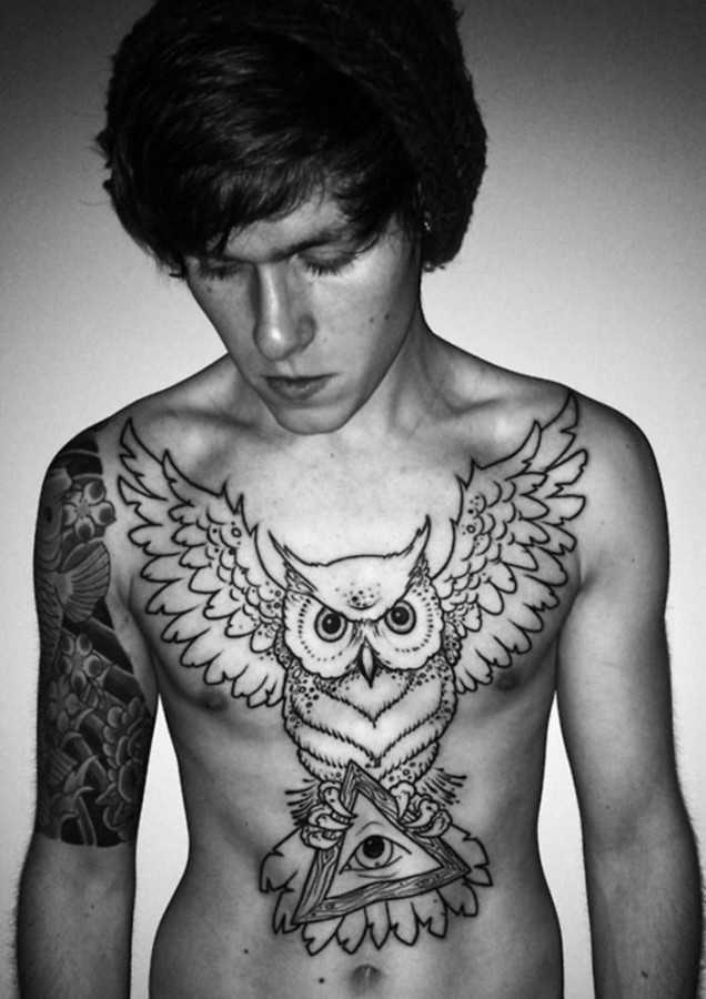 Boy chest owl tattoo