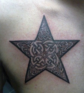 Brown star tattoo