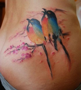 Colorful bird watercolor tattoo