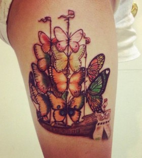 Colorful butterflies and ship tattoo