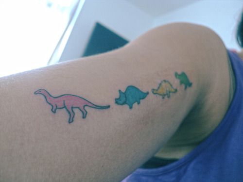 Colorful small dinosaur tattoo