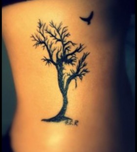 Cute bird and tree tattoo