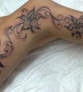 Cute flowers legs tattoo