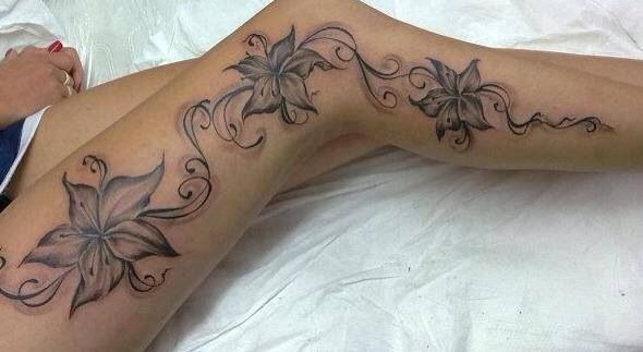 Cute flowers legs tattoo