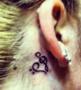 Ear music style tattoo