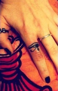Eye on finger Egypt style tattoo