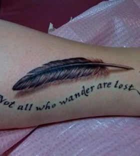 Feather and quote tattoo