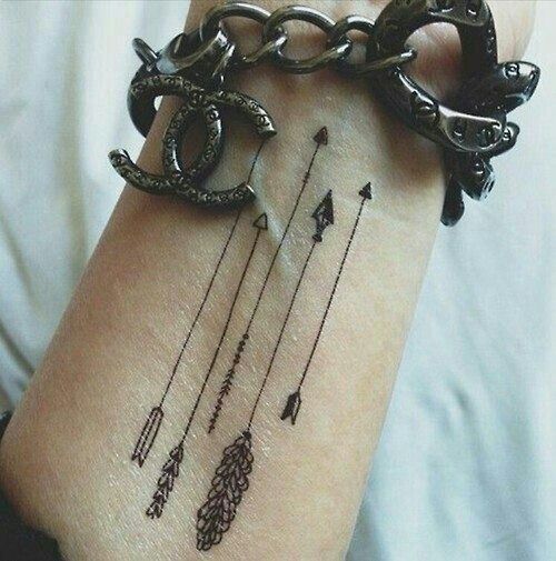 Feather arrow tattoo