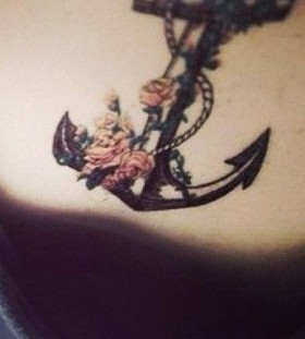 Flowers and anchor girl tattoo