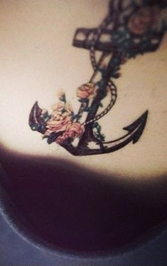 Flowers and anchor girl tattoo