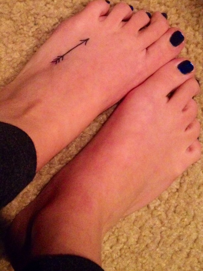 Foot arrow tattoo