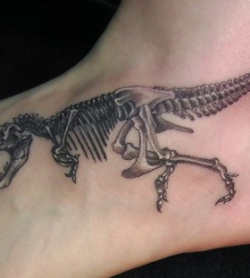 Foot dinosaur tattoo