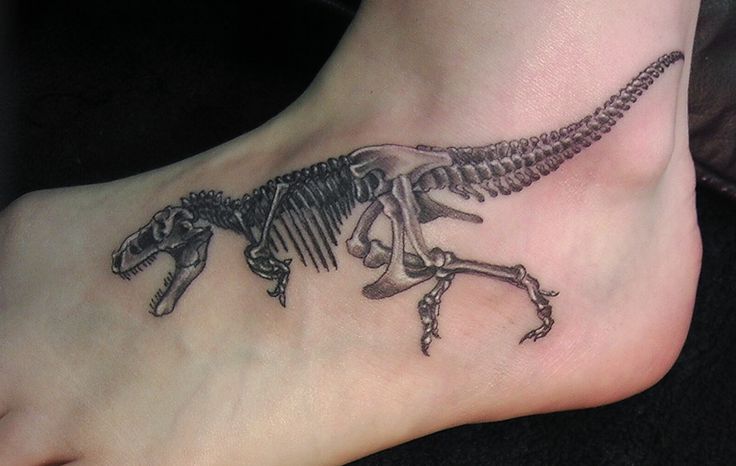 Foot dinosaur tattoo