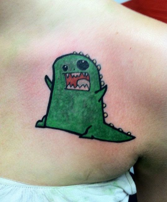 Funny green dinosaur tattoo
