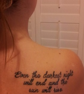 Girl's back quote tattoo