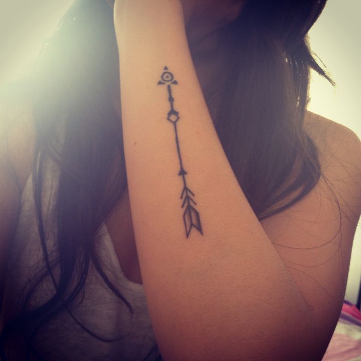 Girls hand arrow tattoo