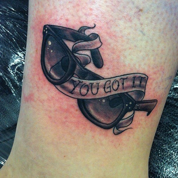Glass and quote tattoo