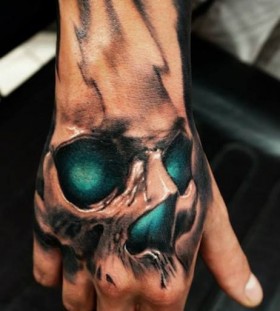 Green eyes skull tattoo