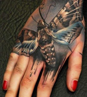 Hand insect tattoo